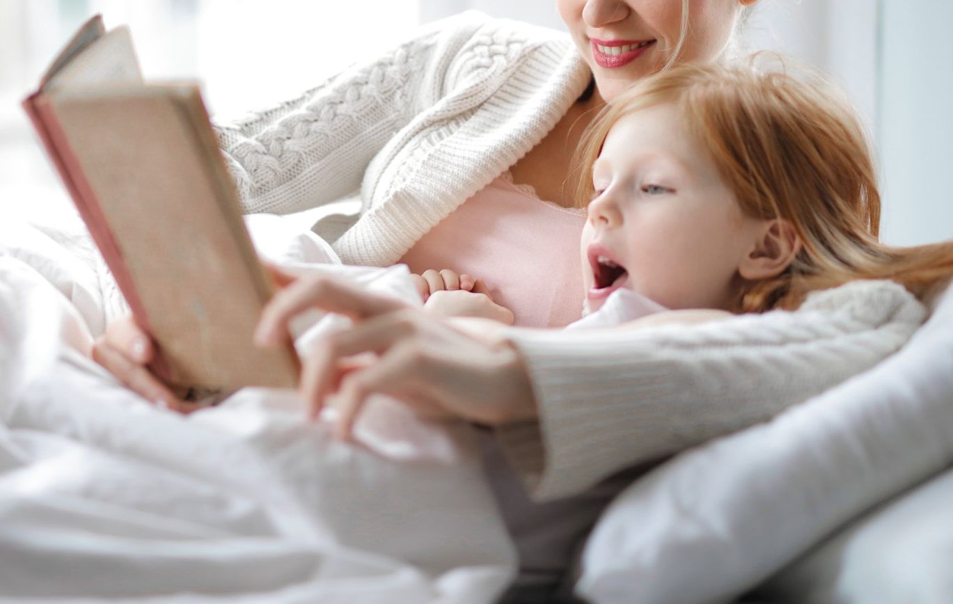 Reading a book with child - ABA Therapy