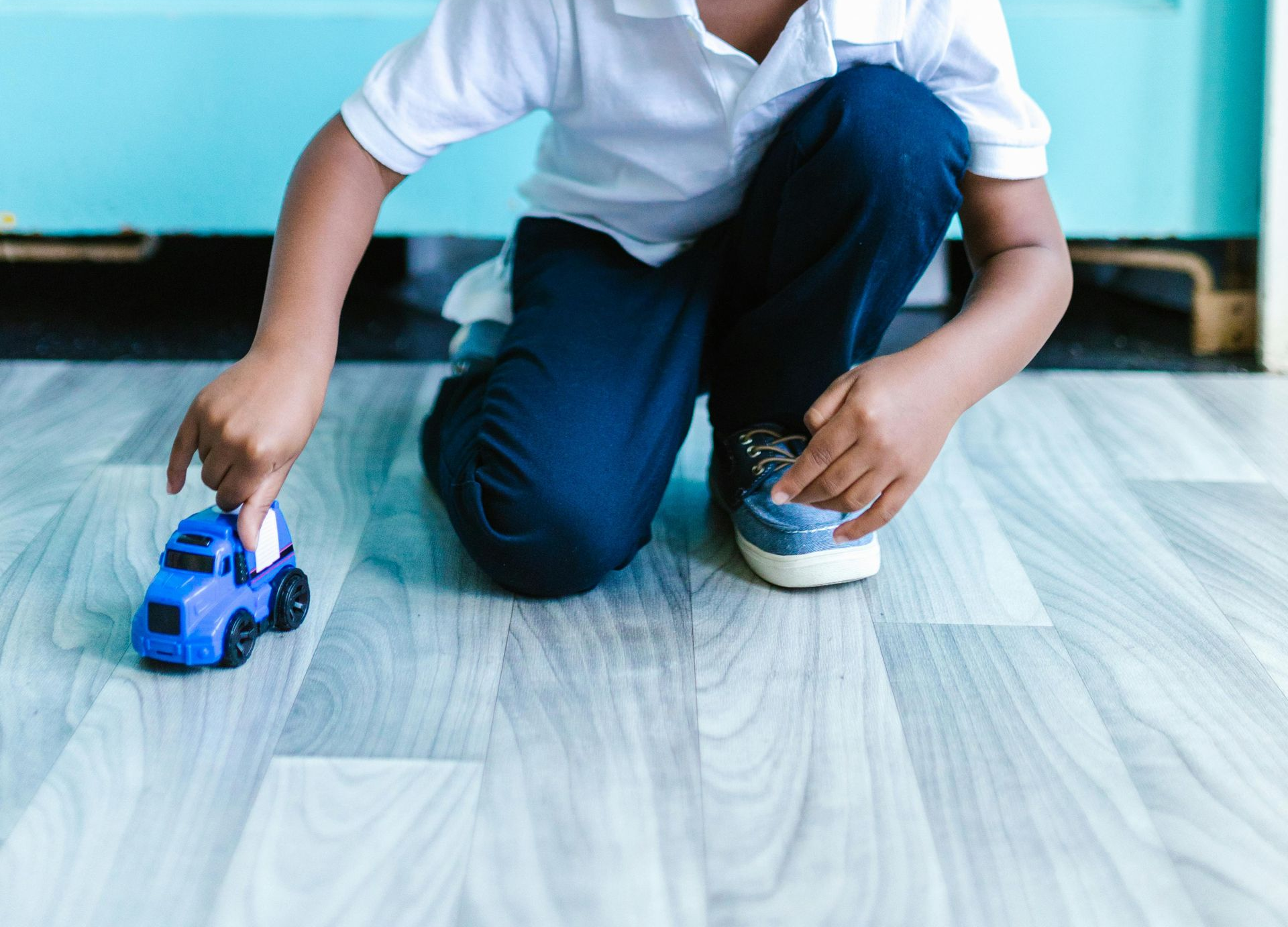 Boy playing with car - ABA Therapy