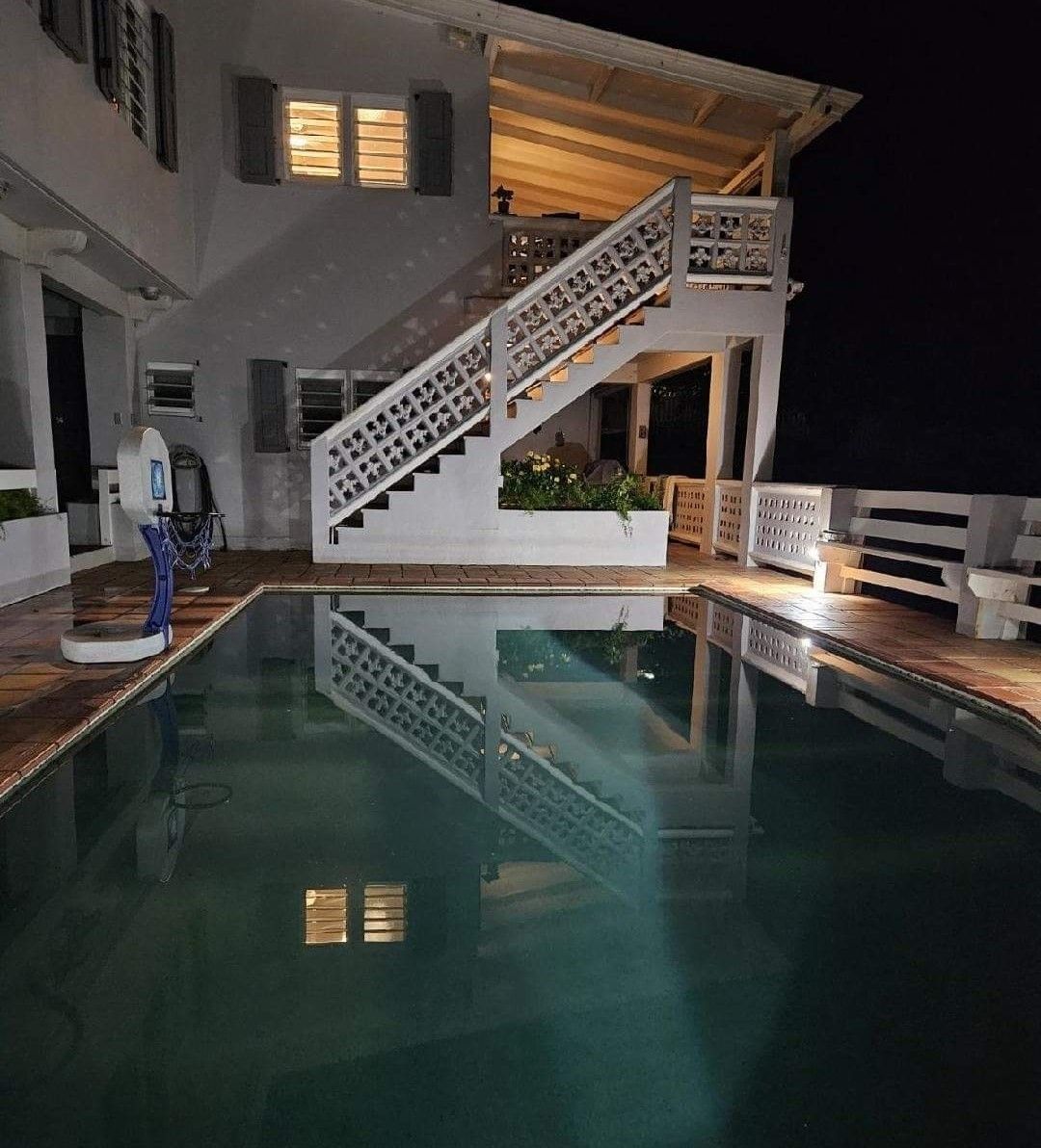 A staircase beside a pool.