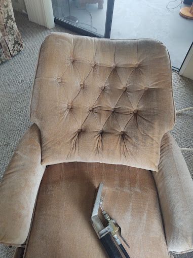 Deep upholstery cleaning on fabric recliner chair with steam extraction tool