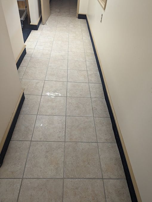 Clean tile hallway with grout restored after professional tile and grout cleaning service