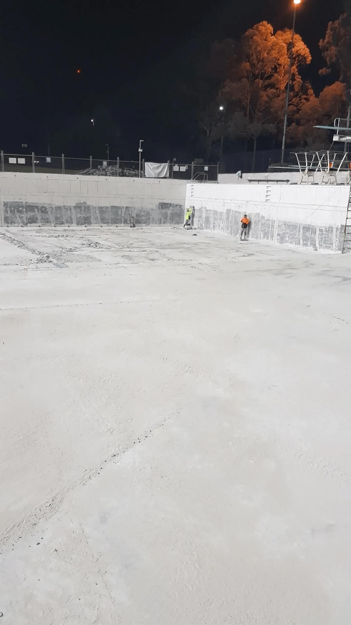 A Concrete Space With Two People — TNT Floor Removal & Demolition in Tewantin, QLD