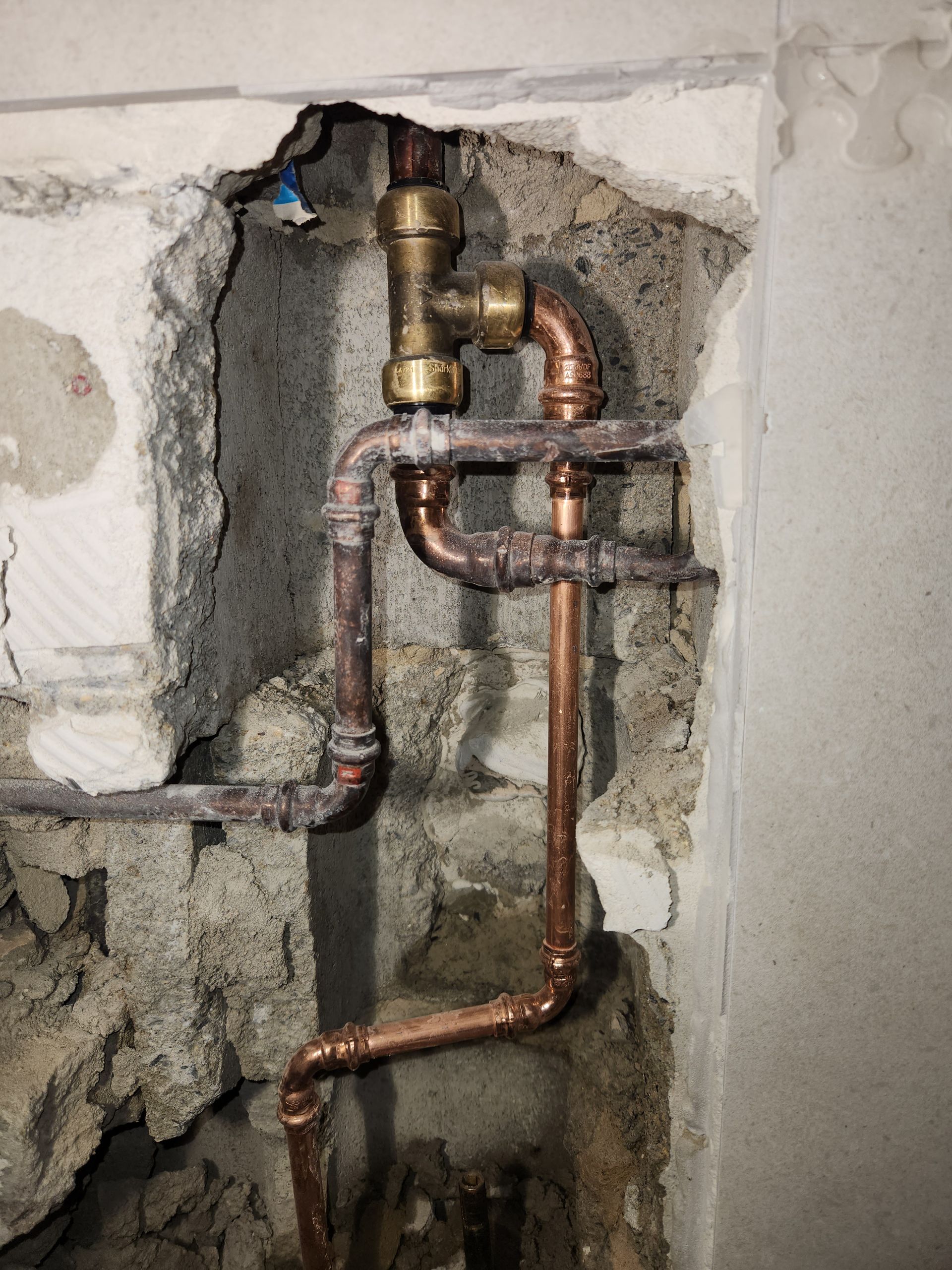 Copper Plumbing Pipes Connected With Brass Fittings Embedded — Kingdom Plumbing Services in Gordonvale, QLD