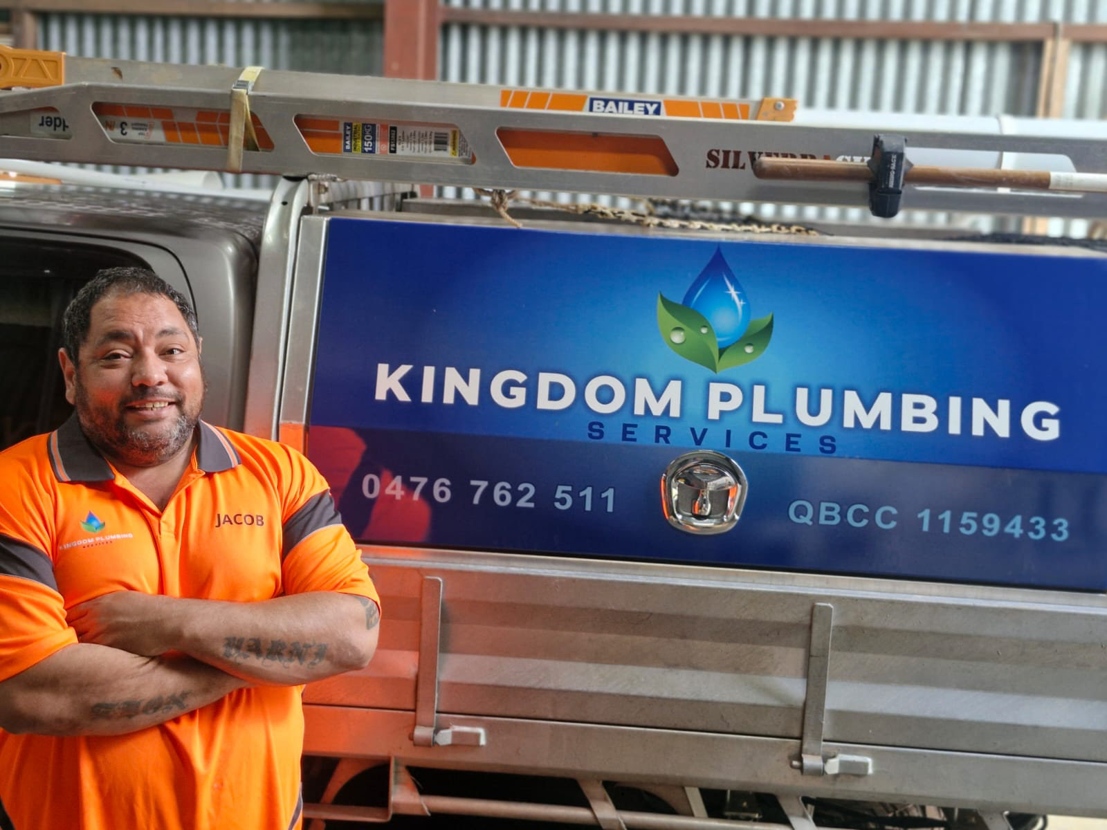 A Black Trailer With a Covered Storage Compartment — Kingdom Plumbing Services in Gordonvale, QLD