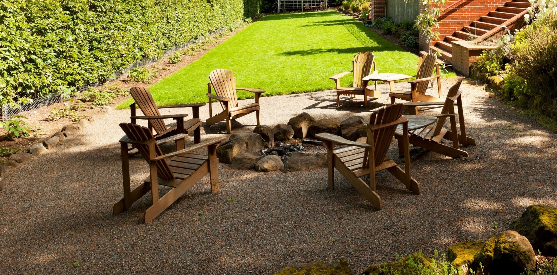 Wooden furniture placed outdoors for a patio installation.