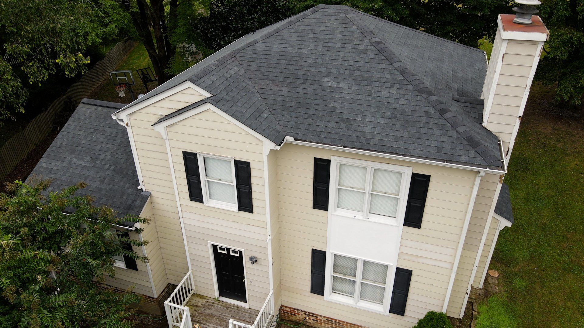 Image of RETEX roof replacement in Midlothian VA 23112. Tamko Heritage Rustic Black architectural asphalt shingles.