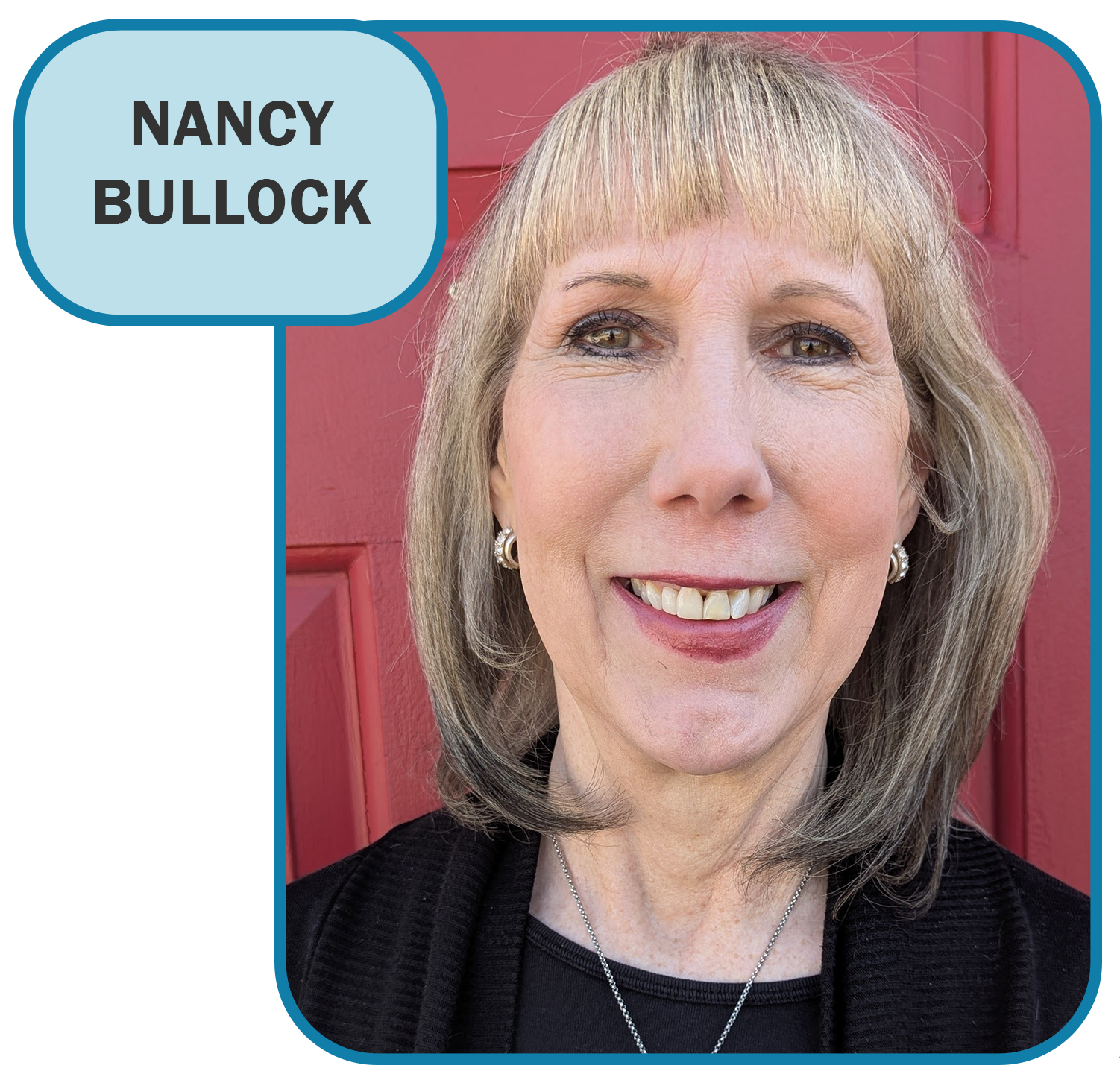 Nancy bullock is smiling in front of a red door