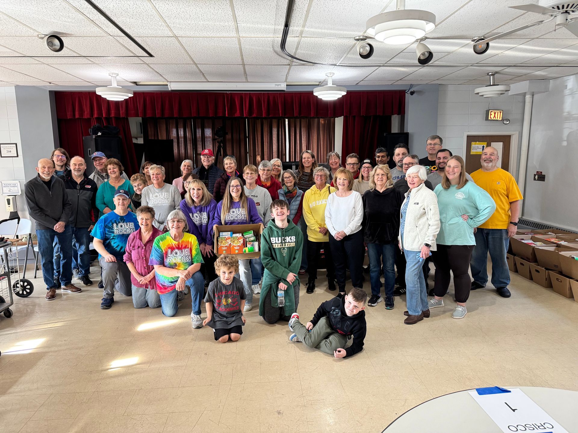 A group of people are posing for a picture in a room.