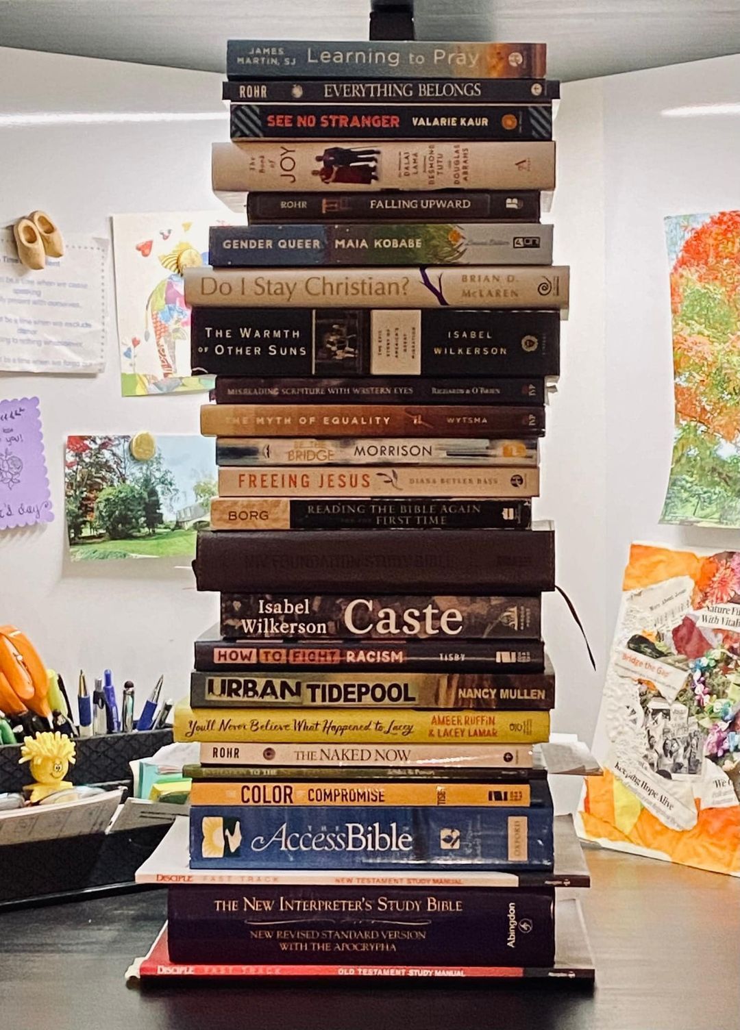 A stack of books sitting on top of each other on a table.