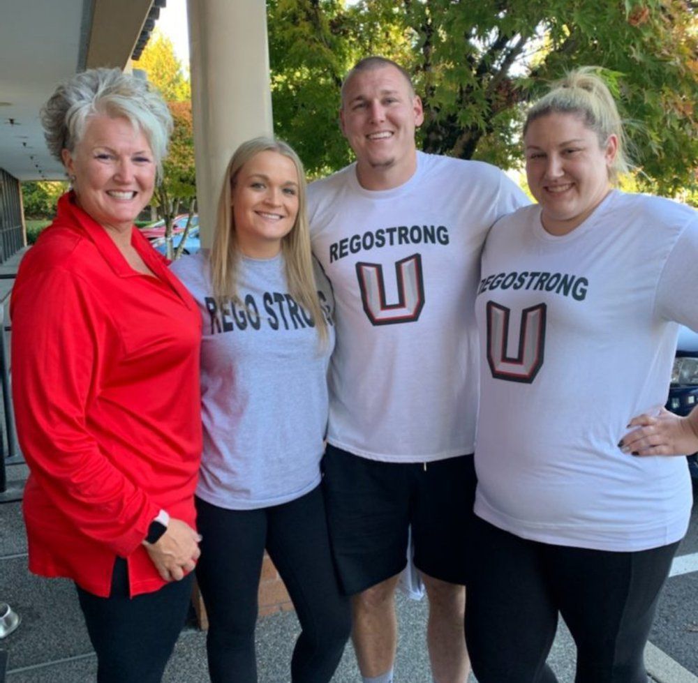 The Rego family together in REGOSTRONG shirts.