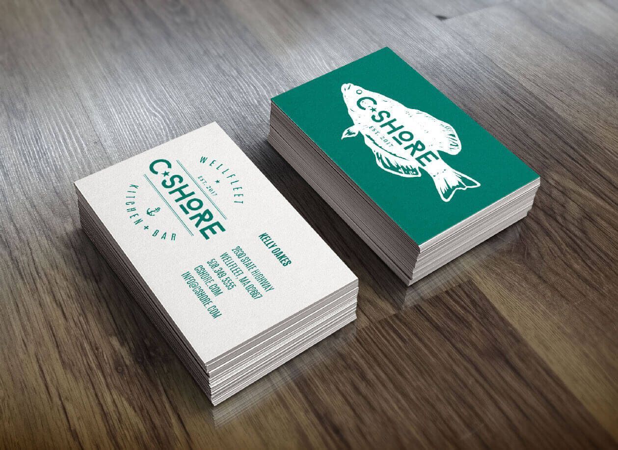 Business cards stacked on wood: