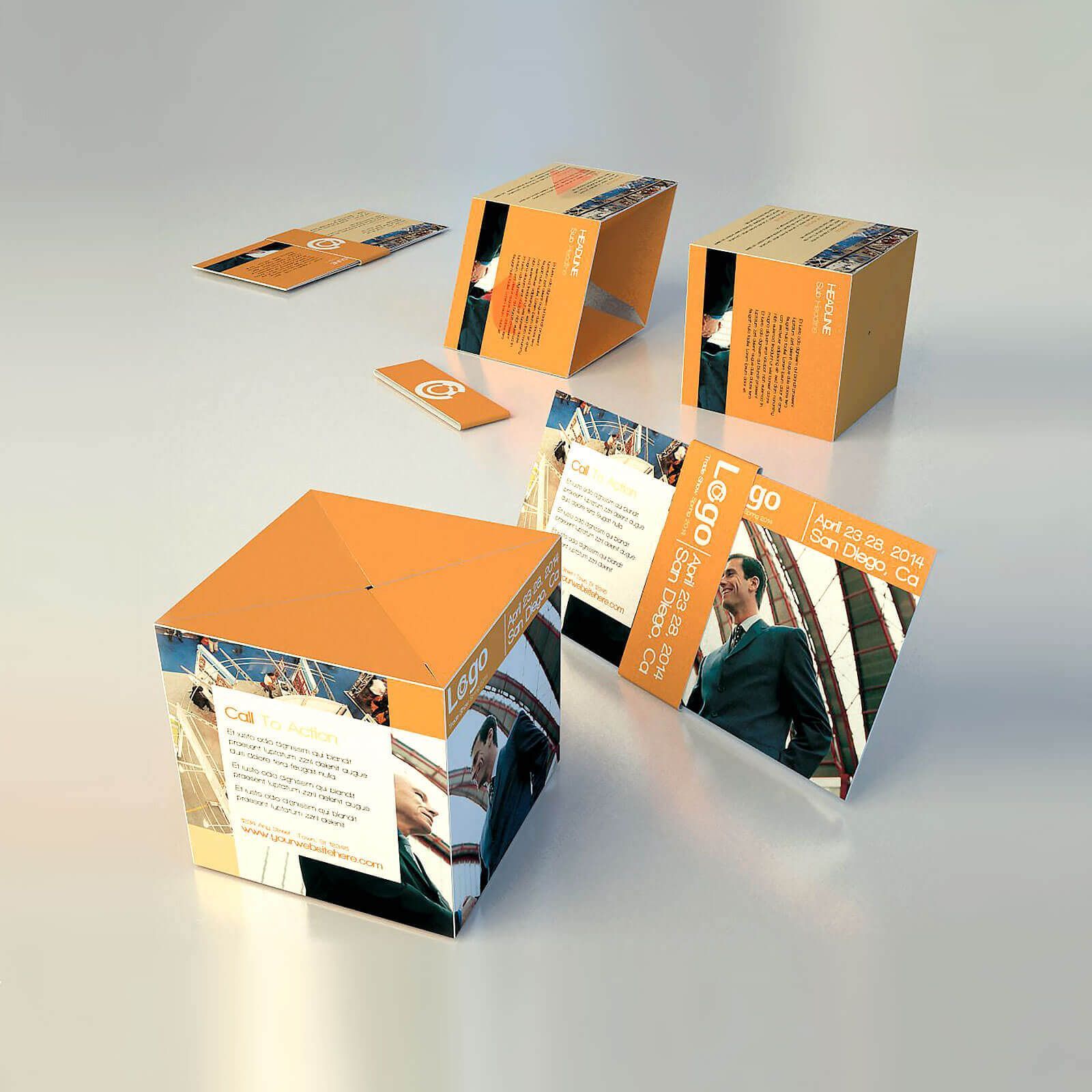 Orange cube-shaped promotional material with business people and text on a white surface.