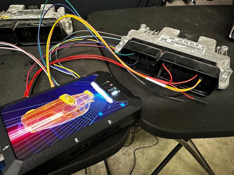 A computer monitor with a picture of a car on it
