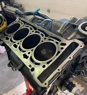 A close up of a cylinder block of a car engine.