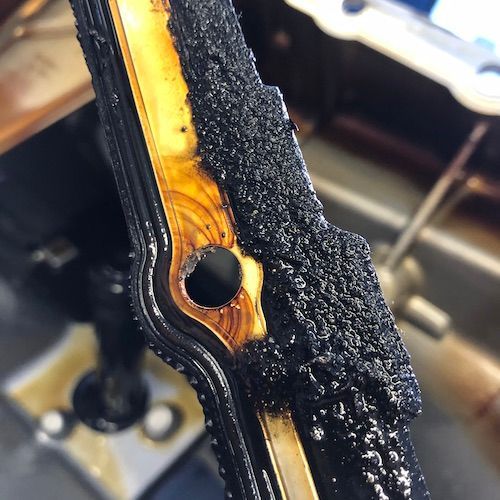 A close up of a piece of metal with a hole in it