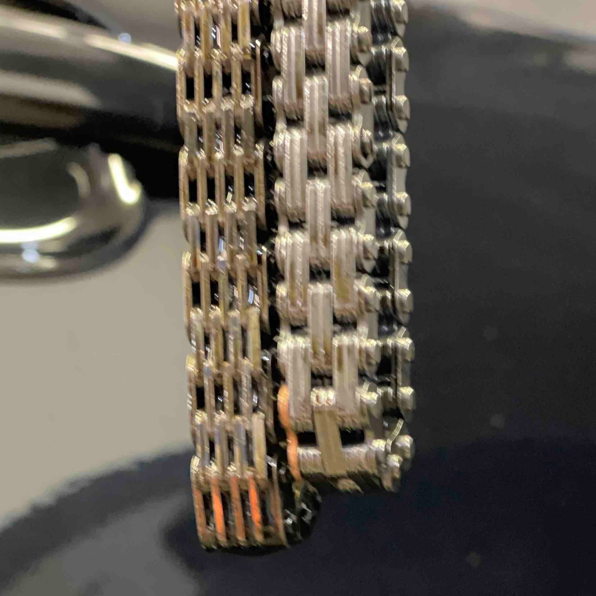A close up of a chain on a car.
