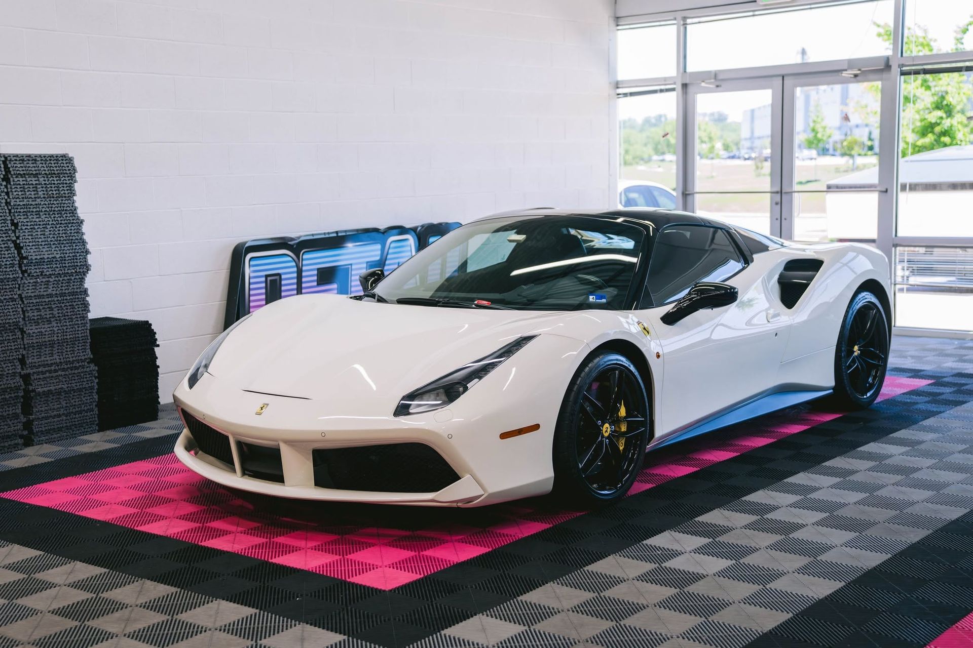 White Ferrari with PPF protection in detailing shop