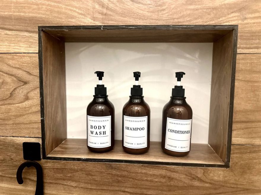 Three brown pump bottles labeled