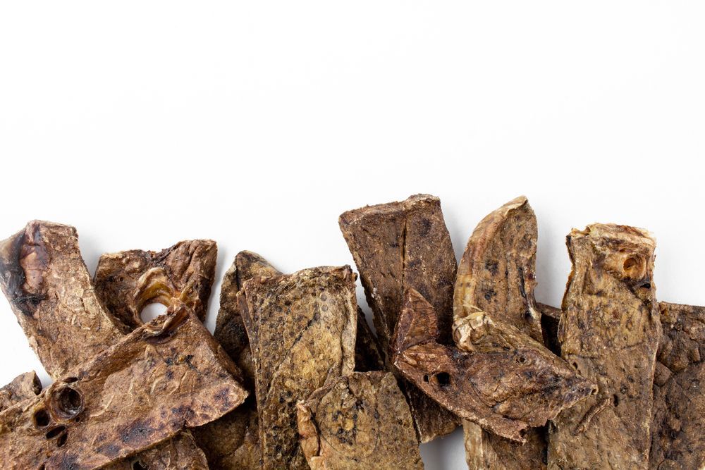 A Pile Of Dried Beef Lungs On A White Background — Cessnock Pet & Greyhound Supplies in Maitland, NSW