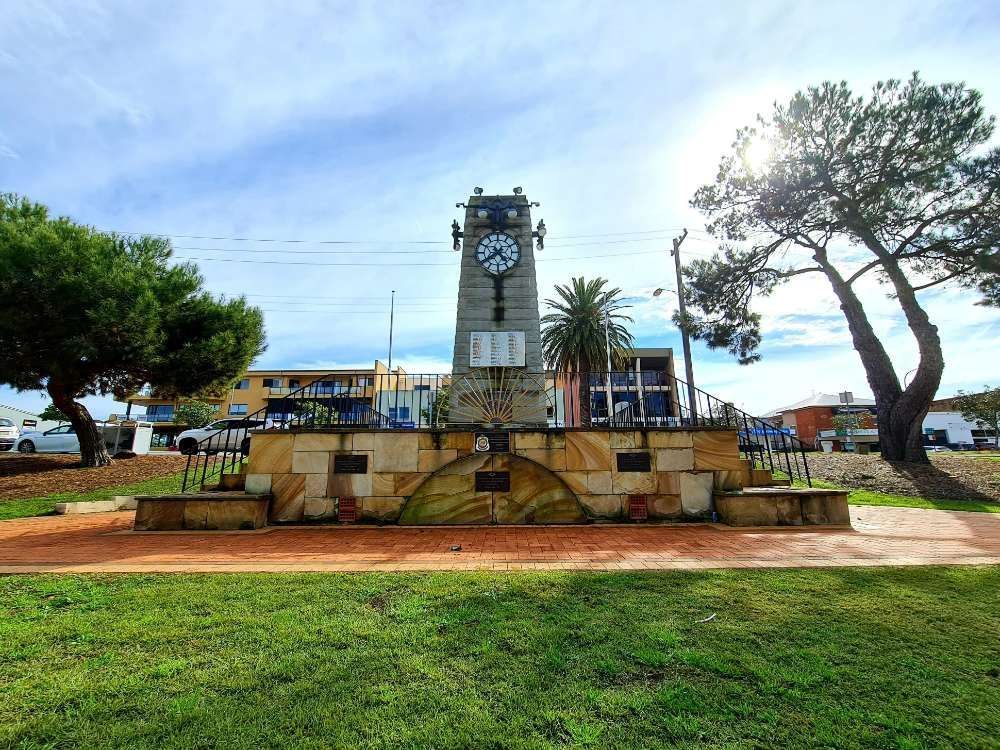 A Large Clock Tower Is Sitting In The Middle Of A Park — Cessnock Pet & Greyhound Supplies in Taree, NSW