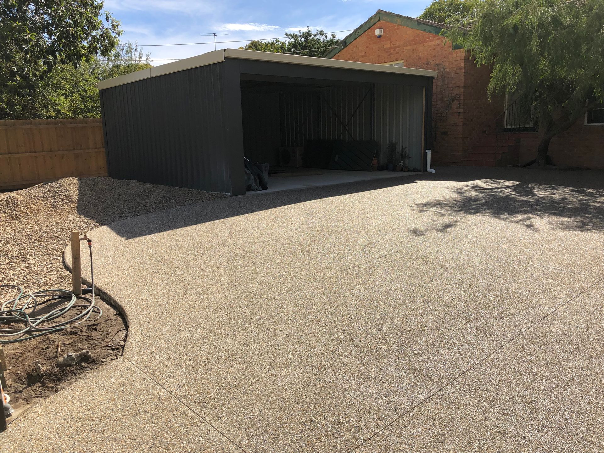 A garage with a bicycle parked in front of it.