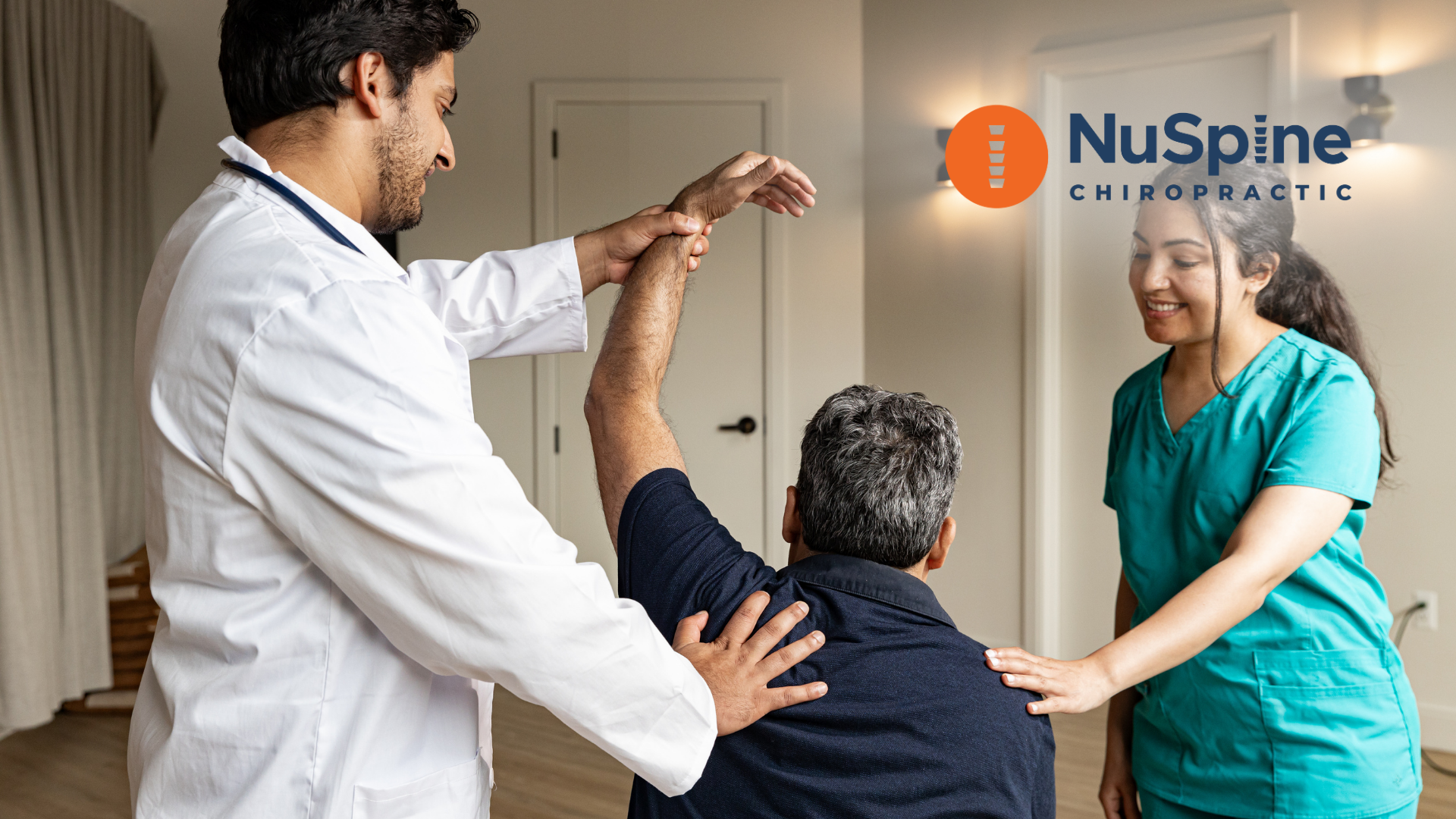 A man in a wheelchair is being examined by a doctor and nurse.
