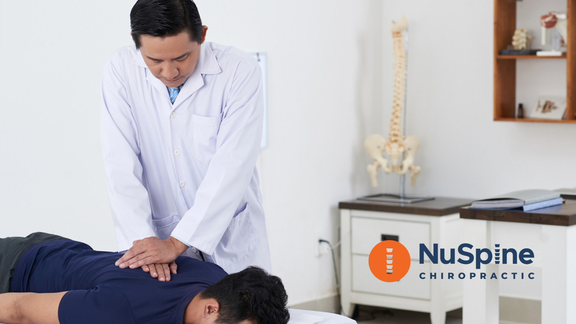 Chiropractor adjusting a patient's back on a table in an office. NuSpine Chiropractic logo visible.