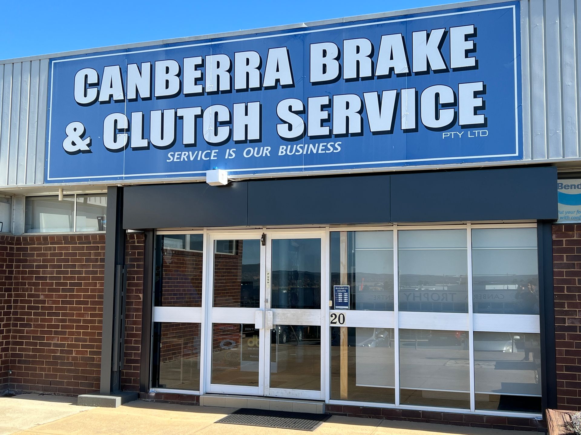 A Person Is Pouring Oil Into a Car Engine — Canberra Brake & Clutch Service In Fyshwick, ACT