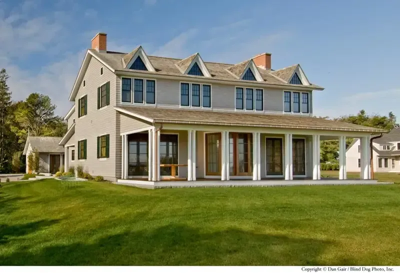 A large house with a large lawn in front of it