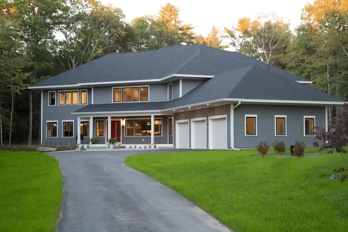 A large house with a driveway leading to it