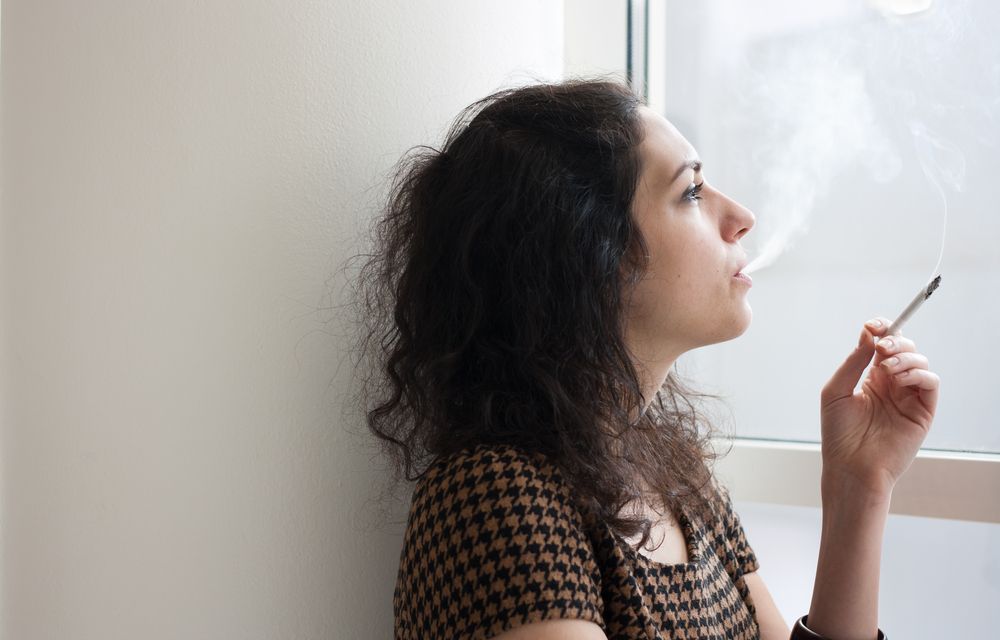 women smoking inside