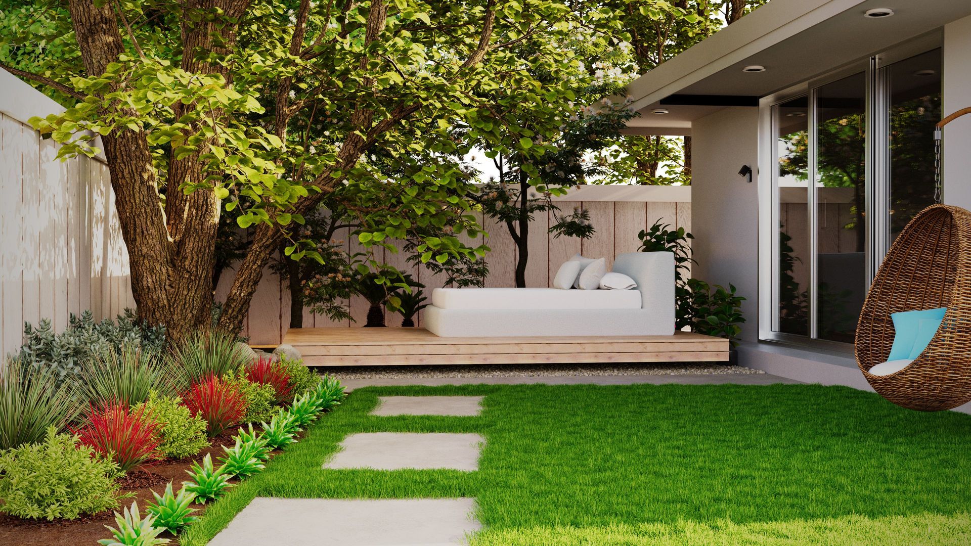 Modern backyard patio with white seating, green lawn, stepping stones, and red flower beds