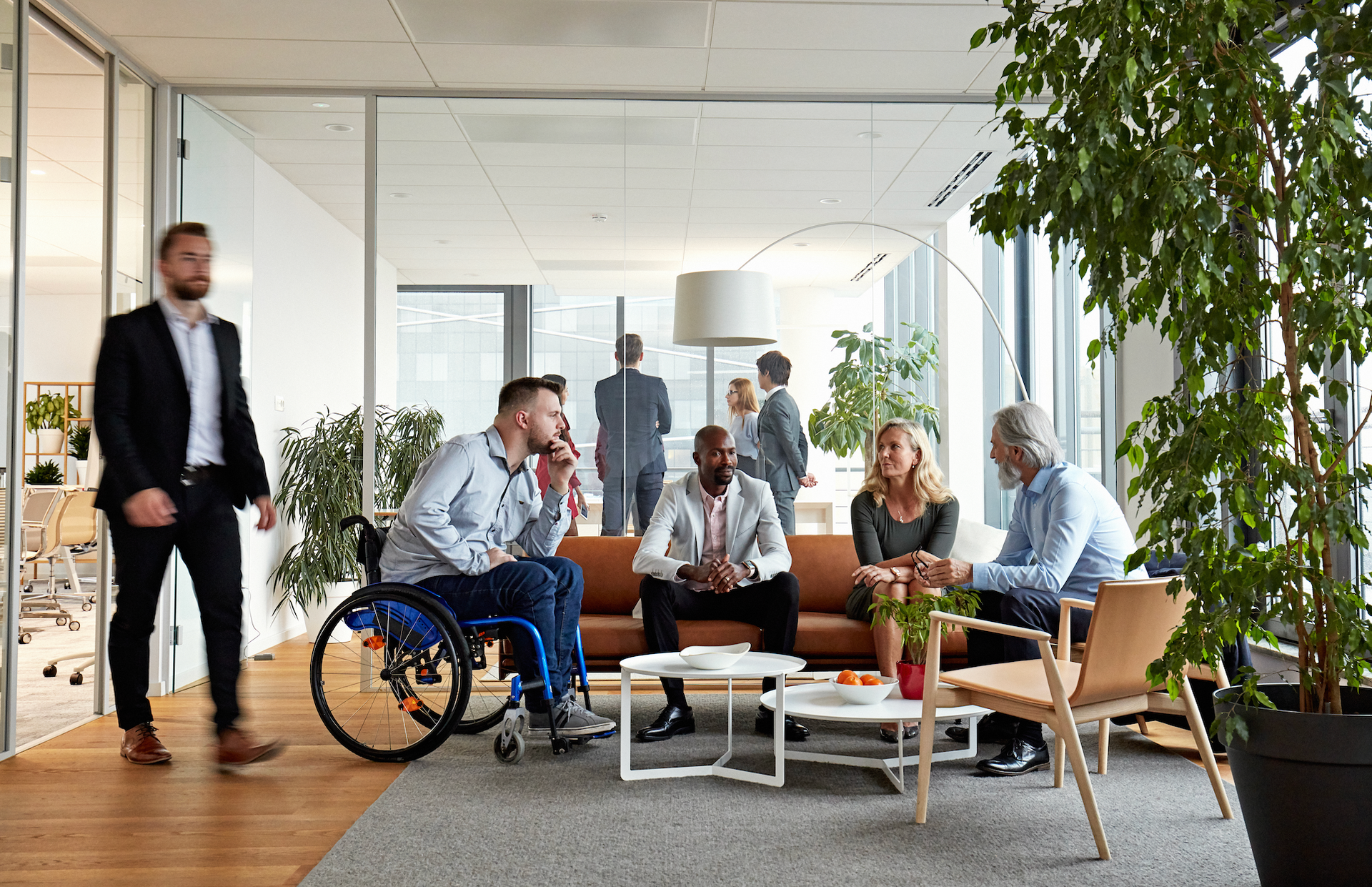 Business group taking a meeting in an office setting