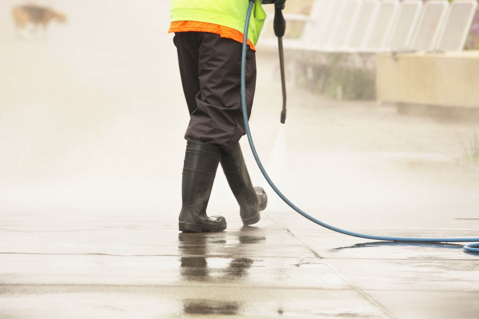 Worker Steam Cleans Sidewalk — Fontana, CA — Morning Star Sweeping Services Inc