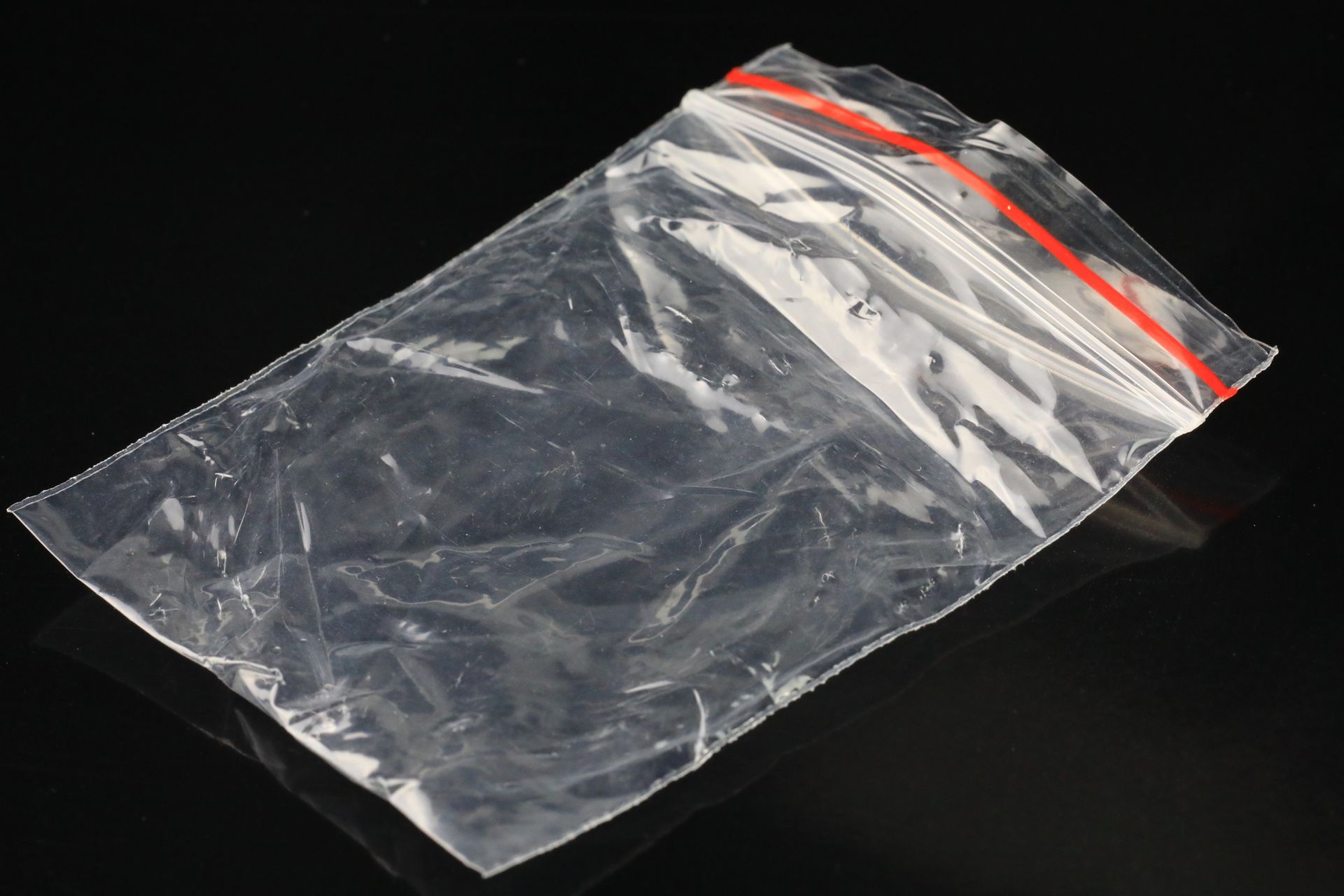 A white aluminum bag with a zipper on a white background.
