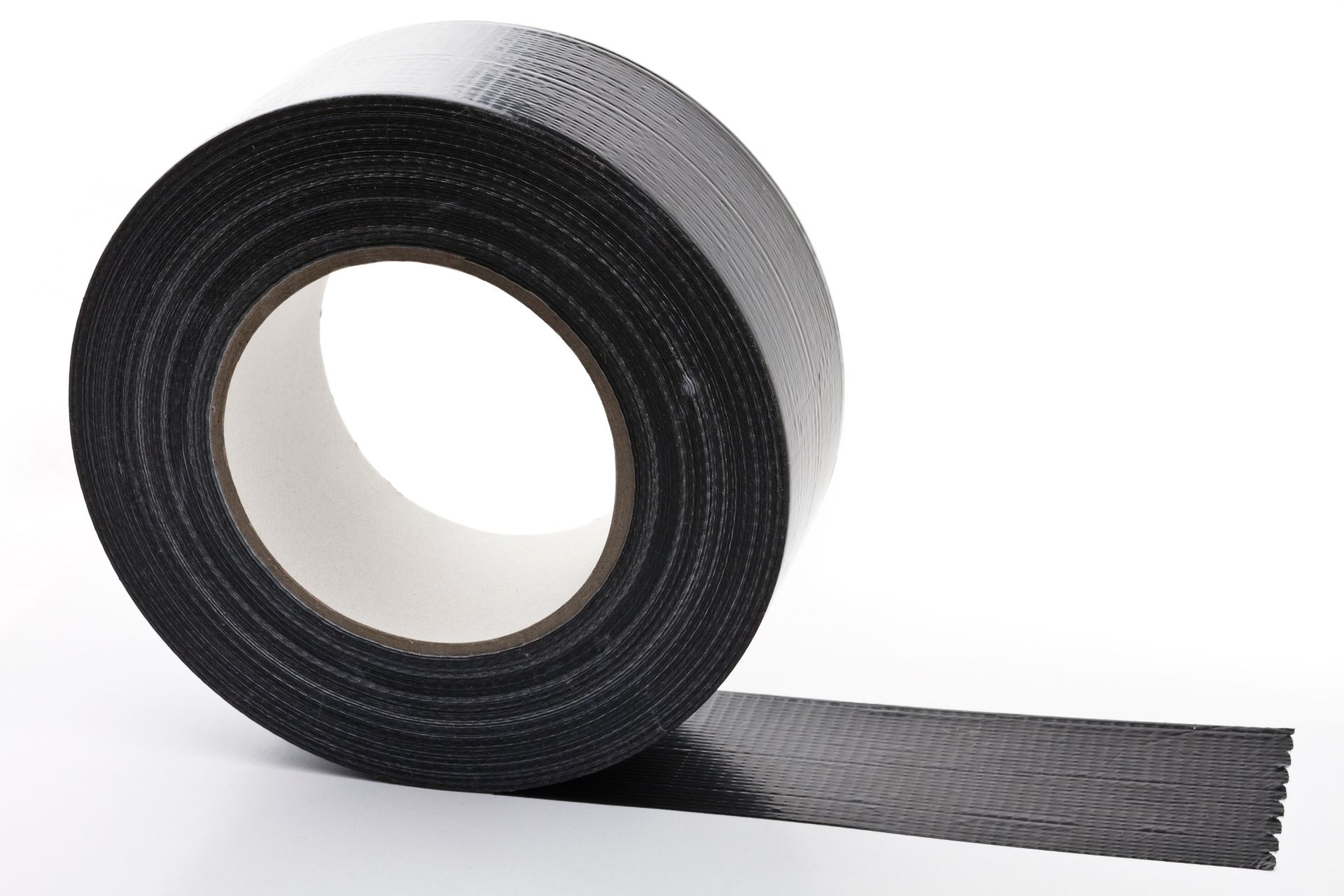 A roll of black tape on a white backgroundgetty