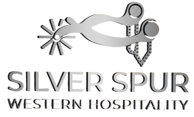 A silver spur western hospitality logo on a white background