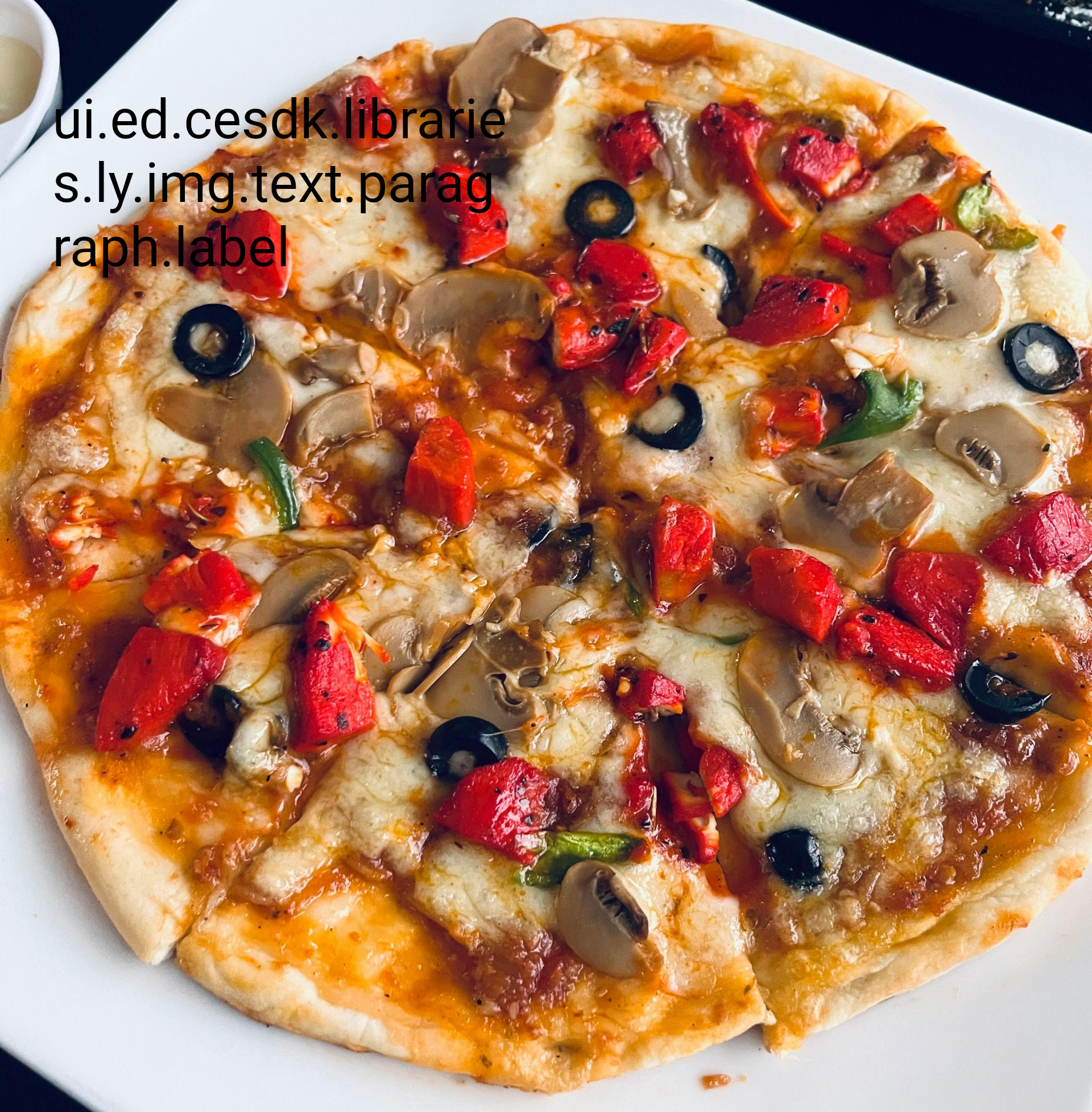 A thin-crust pizza topped with melted cheese, red bell peppers, sliced mushrooms, and black olives on a white plate.