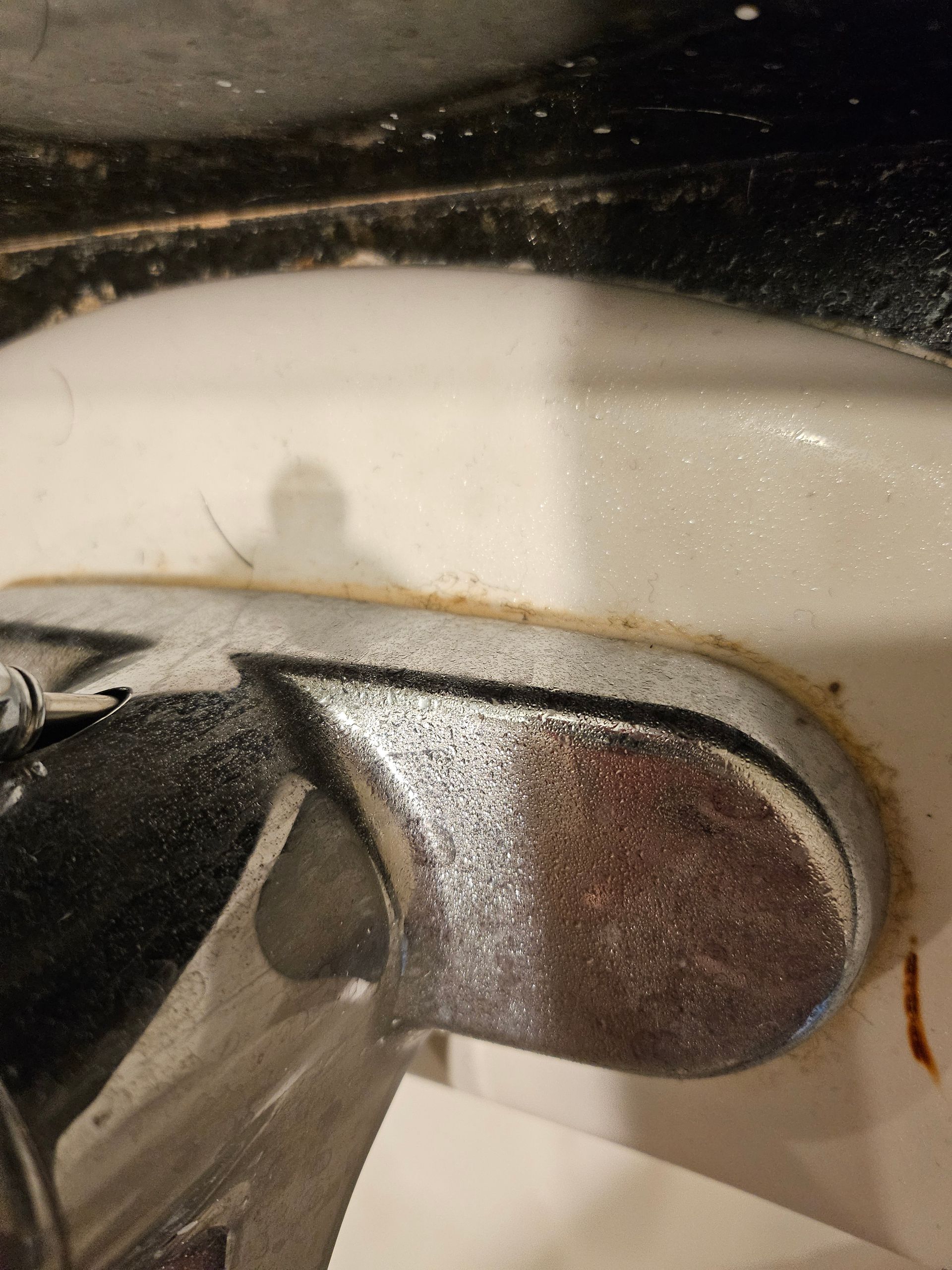 A close up of a faucet on a bathroom sink.