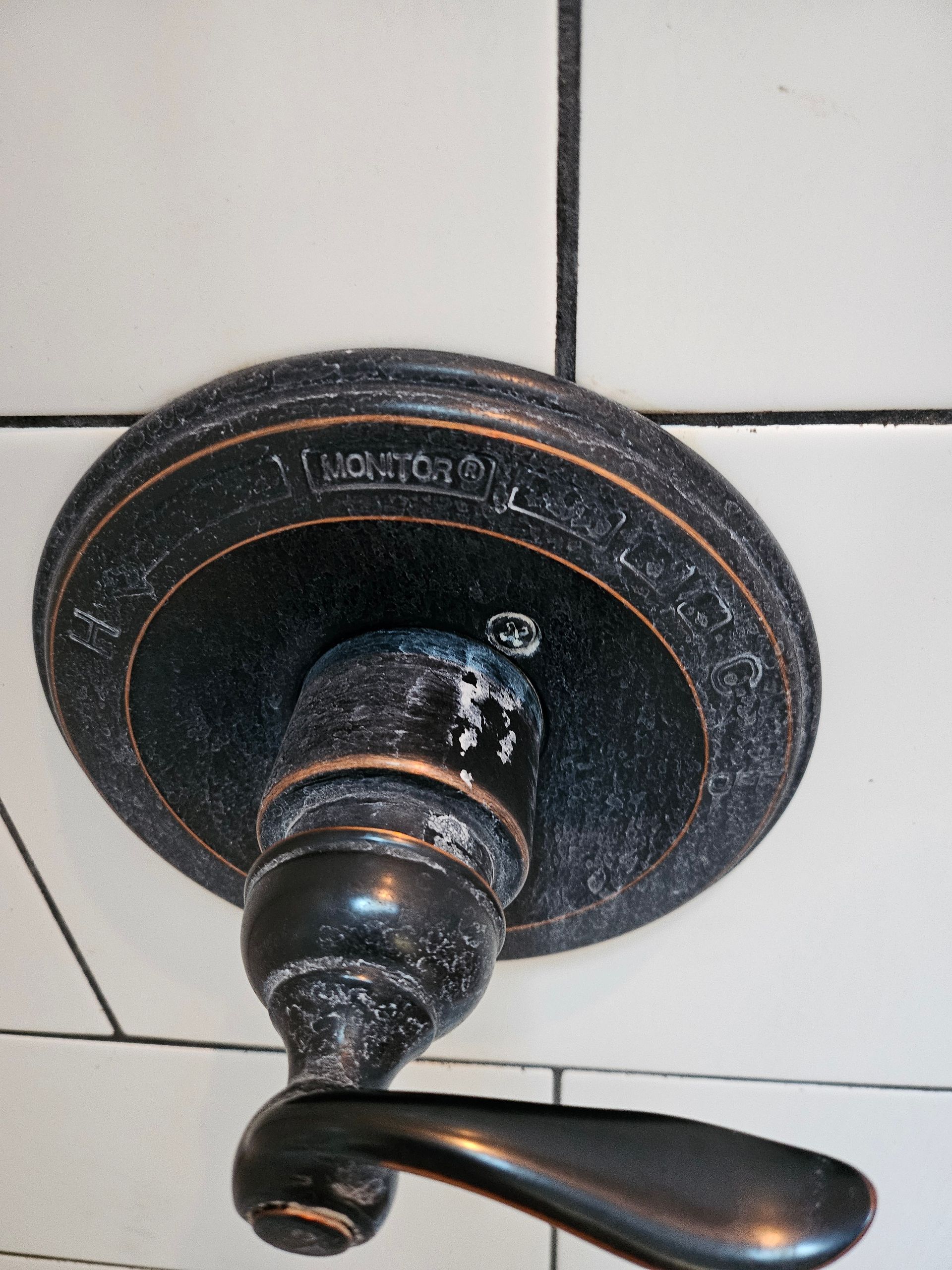 A close up of a faucet that says jackson on it