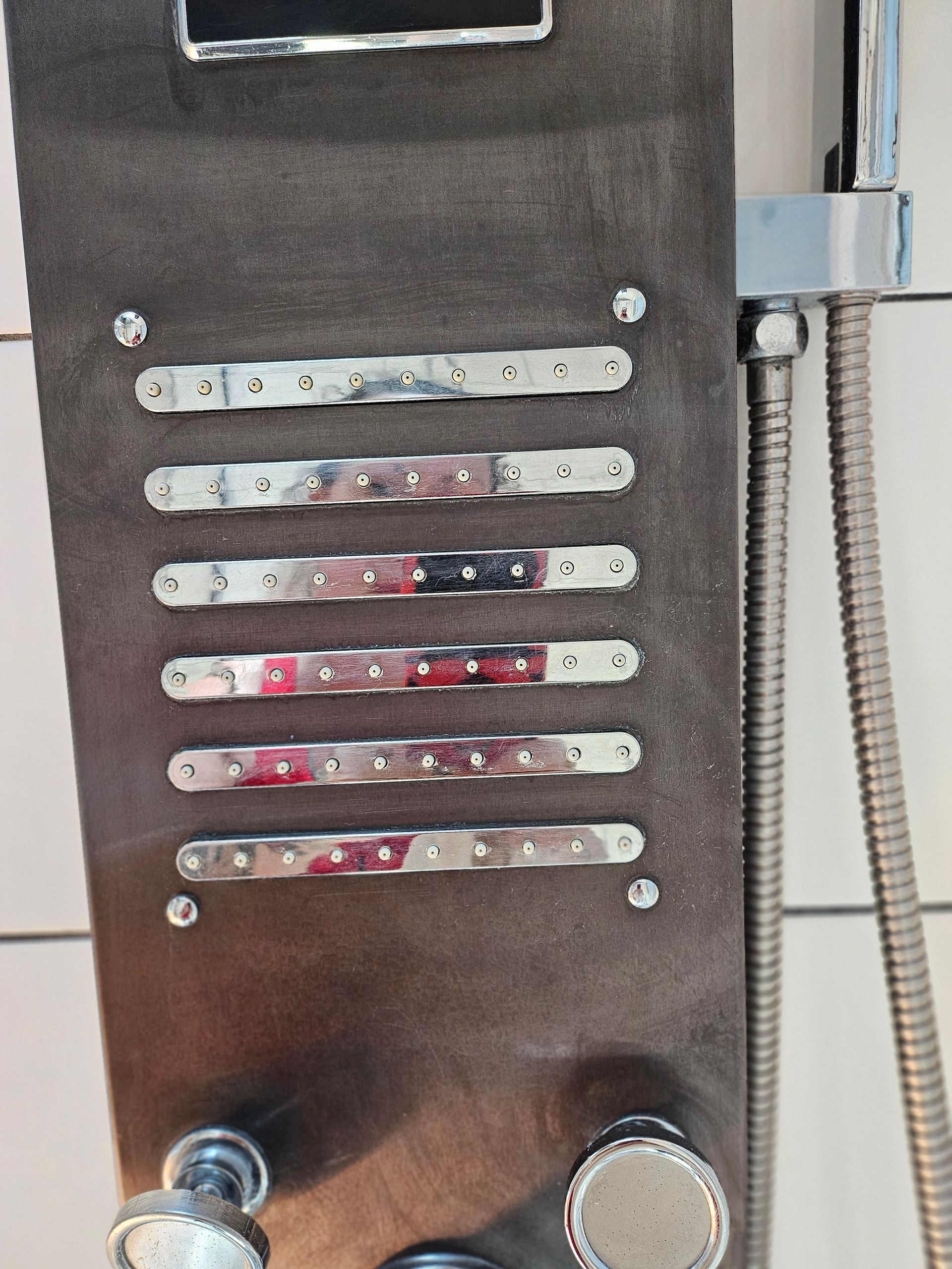 A shower head with a hose attached to it
