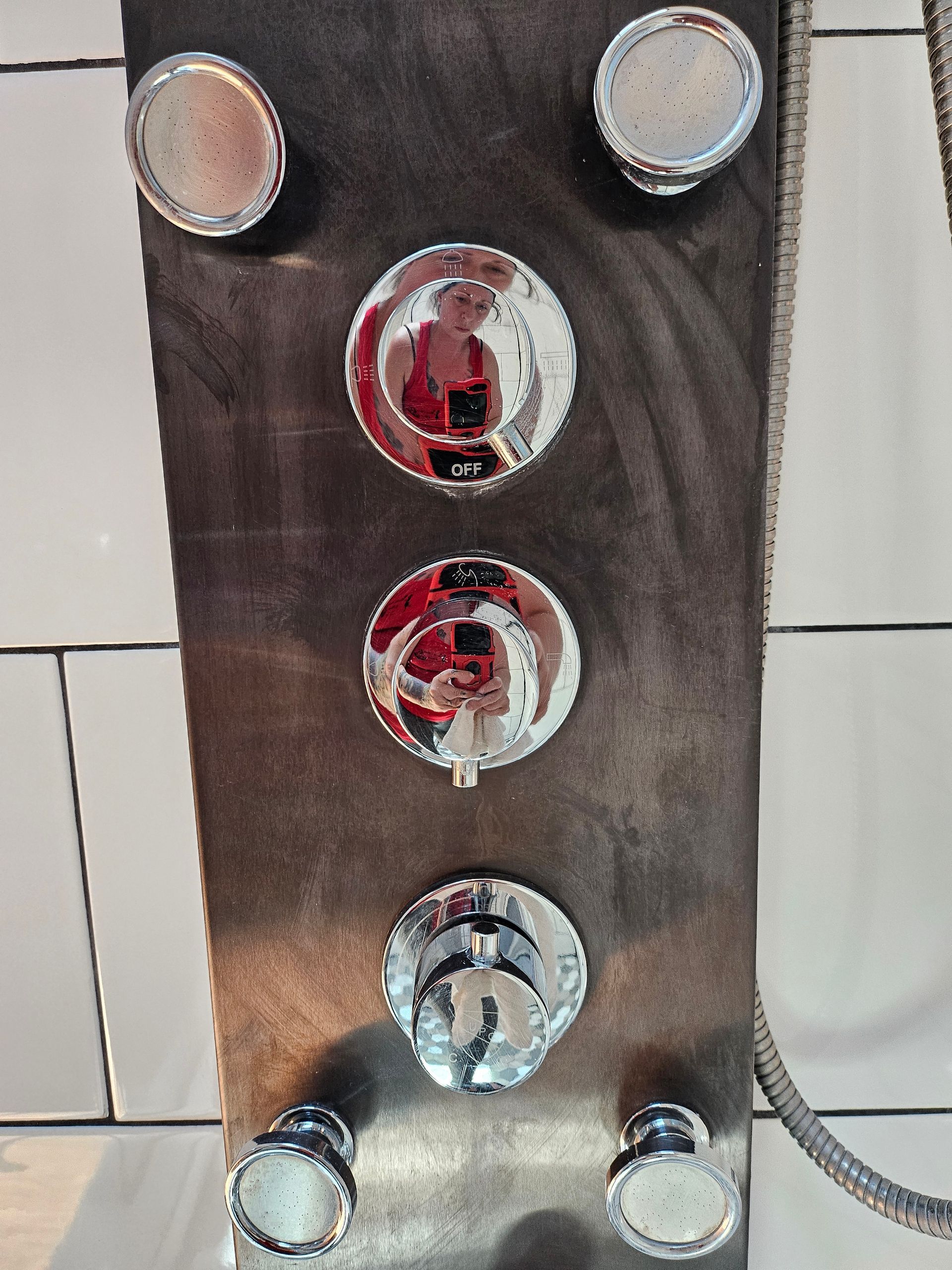 A shower head with a hose attached to it