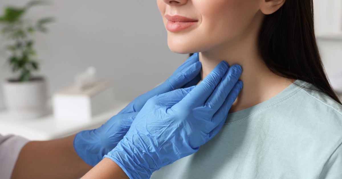 a female patient being examined for Hyperthyroidism Treatments NYC - Dr. John Salerno