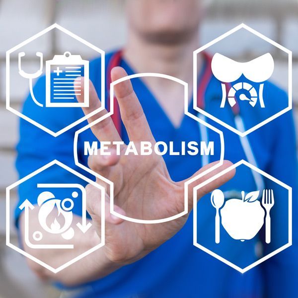 A doctor is pressing a button that says metabolism representing Nutritional and Metabolic Testing