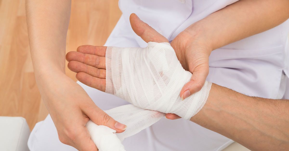 A person's hand being bandaged by Mobile Wound Care NYC - Dr. John Salerno 
