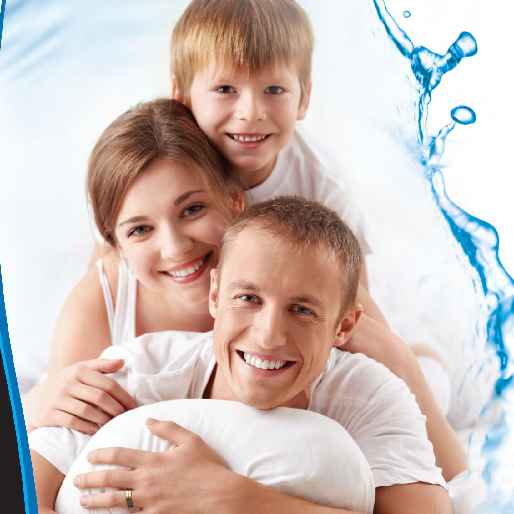 Family smiling, embracing. Woman, boy, man in white, on bed. Water splash graphic in the corner.