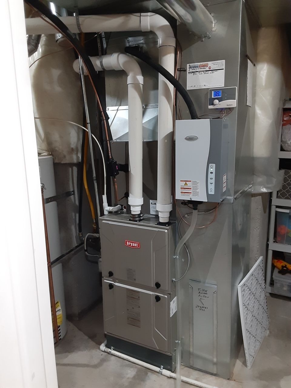 A picture of an air conditioner in a basement.