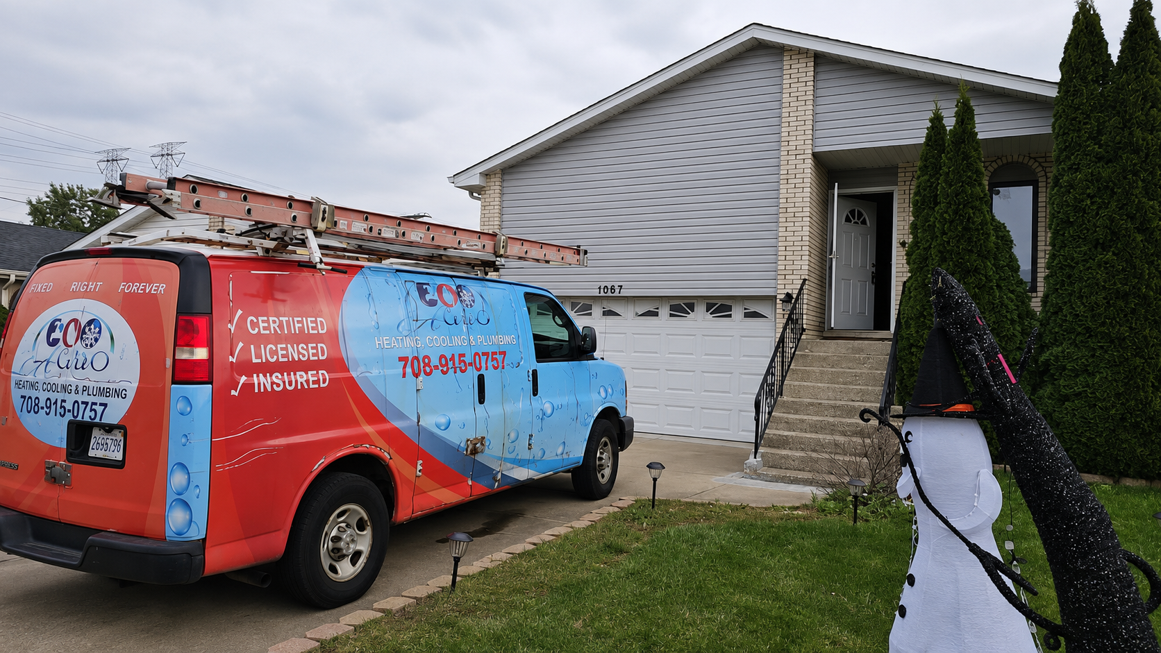 Red and blue service van parked in front of a suburban house with a damaged roof and siding