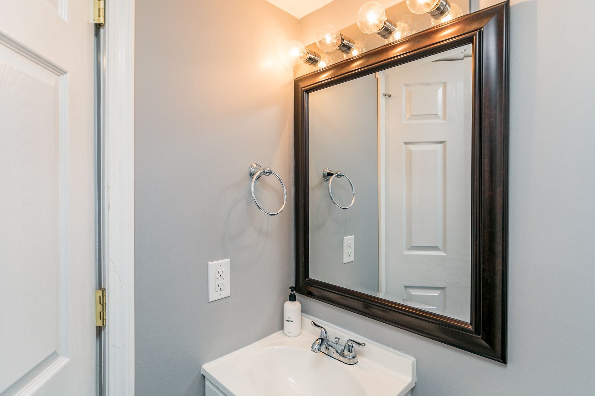The Stadium House sink and mirror