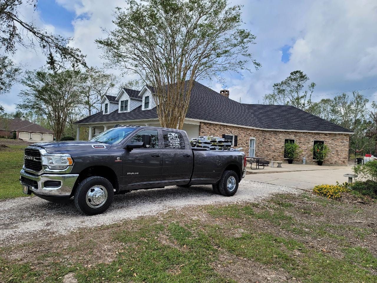 Company truck in front of house